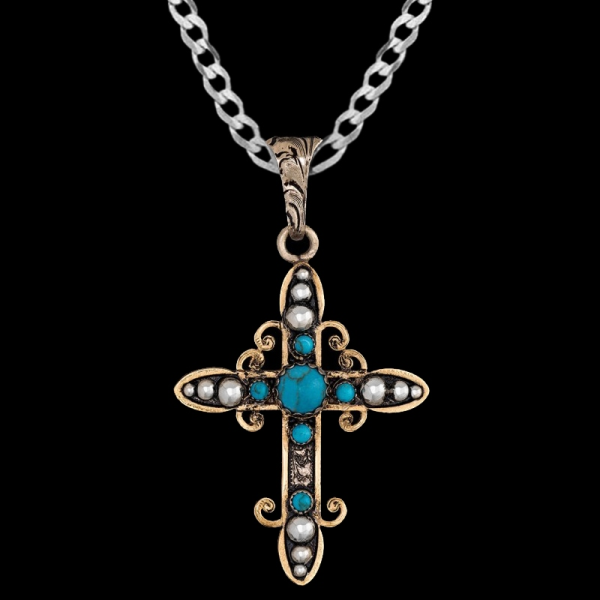 Joshua, German Silver 1.6"x2.3" cross with beaded details, simulated turquoise, and framed with Jewelers Bronze.


Chain not included.